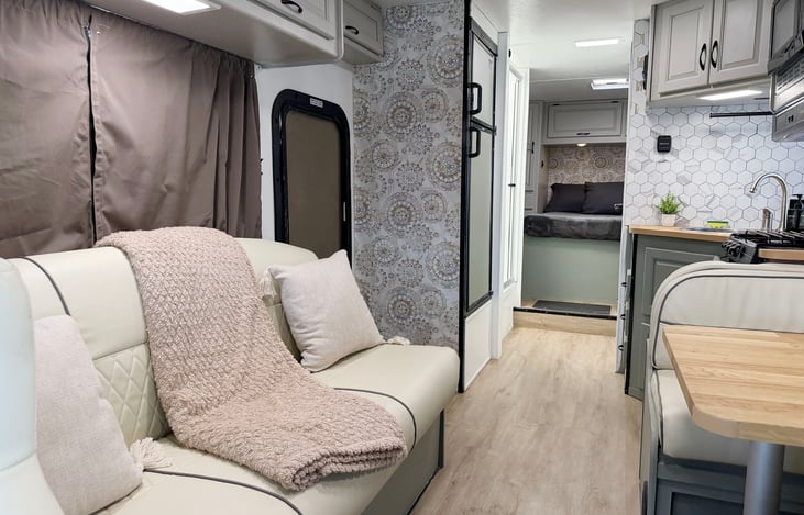 Cozy RV living area with comfortable seating – relax and enjoy your home on wheels