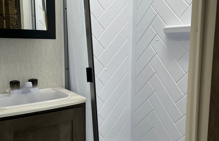 bathroom stand up shower, vanity, toilet