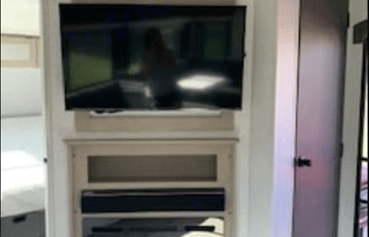 Enjoy a 42" Roku TV, HDMI 2-zone Stereo System with outside speakers, and a beautiful electric fireplace.