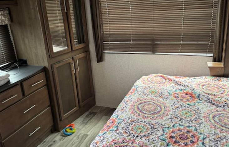 Bedroom--King bed with double closet and dresser. Television with Firestick over dresser. Access to bathroom from bedroom. All linen provided.