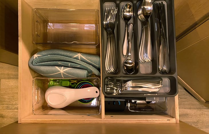 We’ve provided silverware for 8 plus cooking utensils conveniently located in drawer under range.