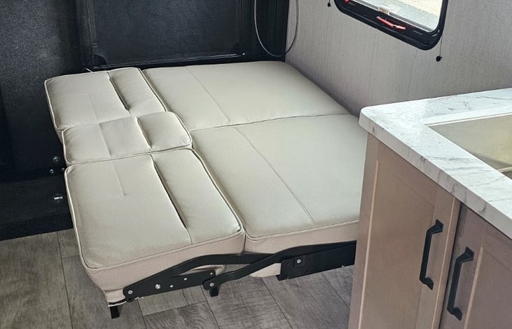Convertible seating for additional sleeping space