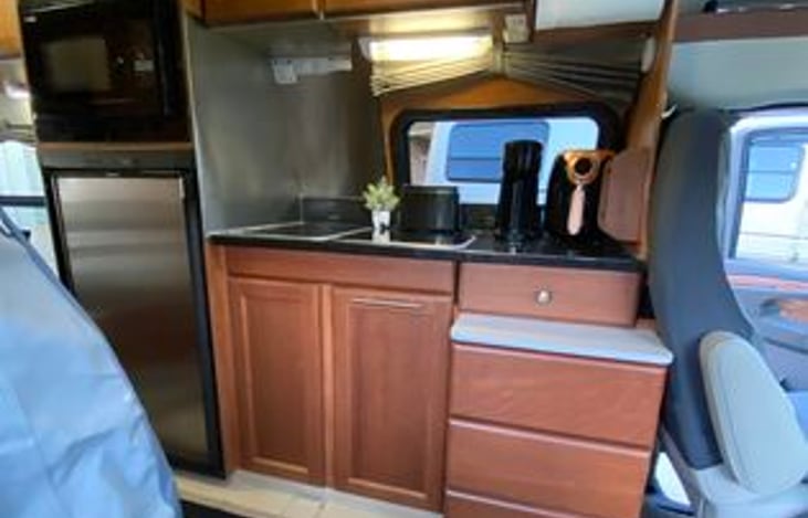 Just bring your food or stop by the store on your trip. Nice sized Fridge & Freezer, Pots and Pans, Kitchen Utensils, Coffee/Kerig, Toaster and small Air Fryer. Also microwave, sink and a stove