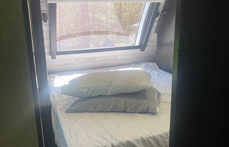 Bedroom with camper queen and mattress topper. Linens provided. Sleeps 2.
