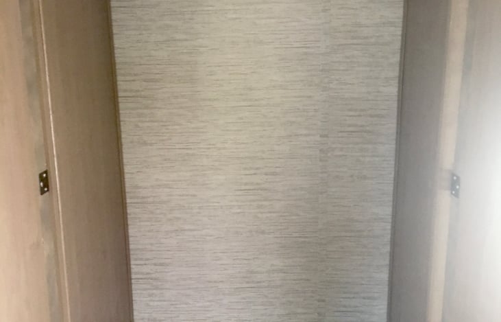 Clothes closet with hanger bar and deep drawer  storage below