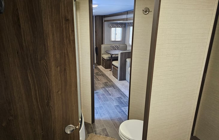 View from the master bedroom, through the master bathroom into the living area.