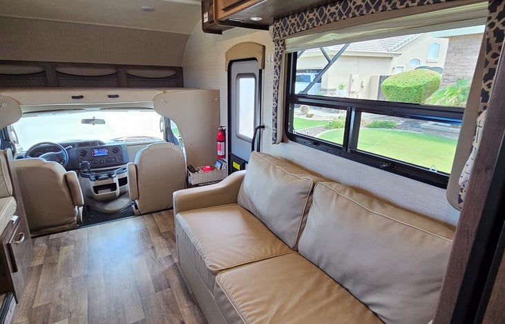 Comfy driver and passenger seats with 8 seat belts.