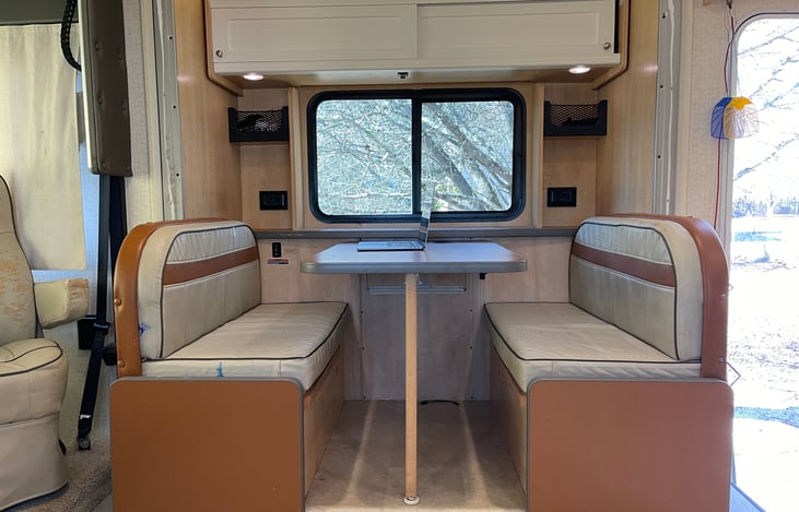 Dining Room table setup. Folds down into a bed. Cushions have some wear and tear due to the dog, same as the couch.