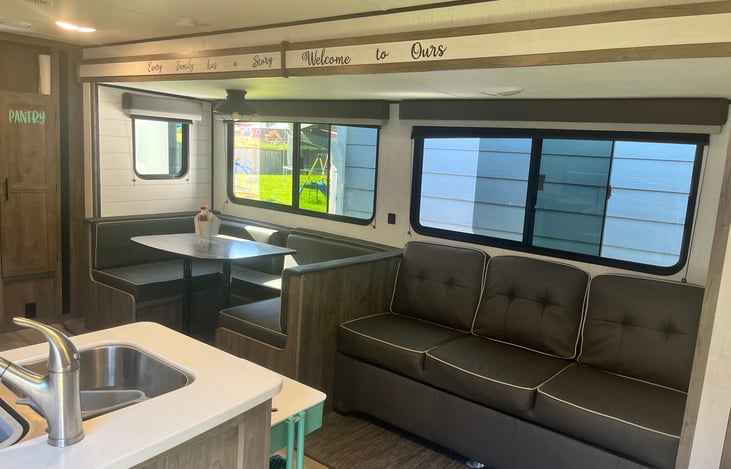 Main living and dining space. Couch and dinette convert into beds.