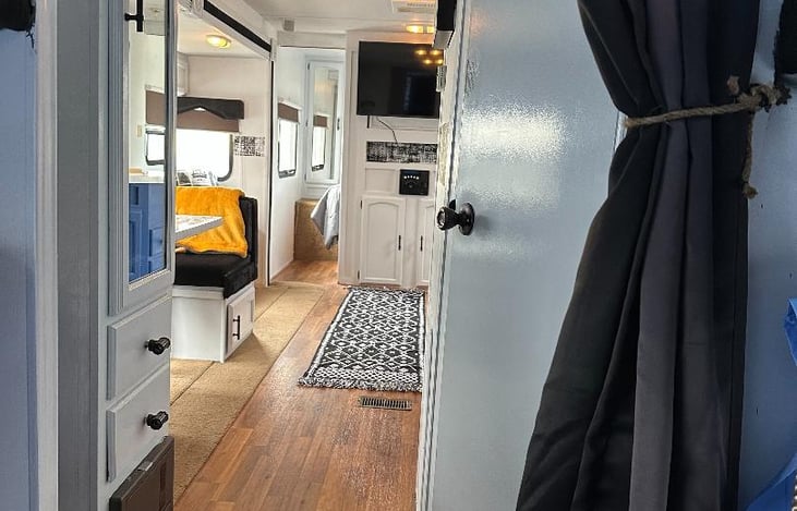 LOOKING OUT FROM DOUBLE BUNK ROOM TO MAIN AREA