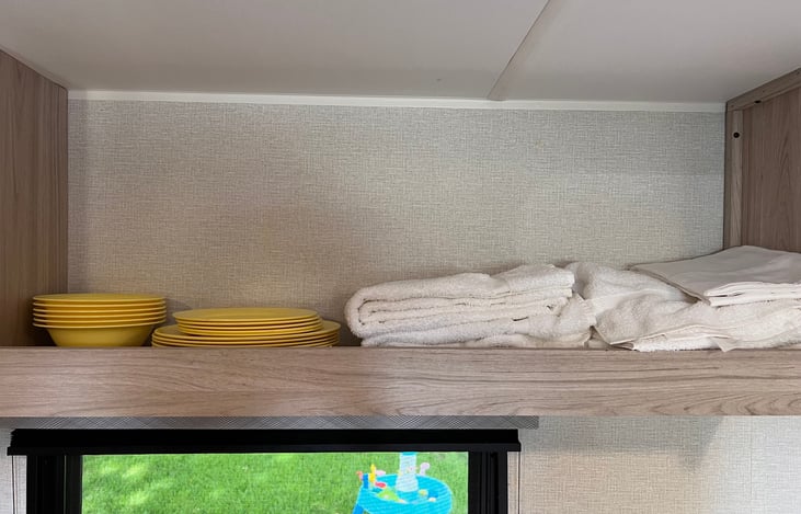 Dishes, extra towels and linens.