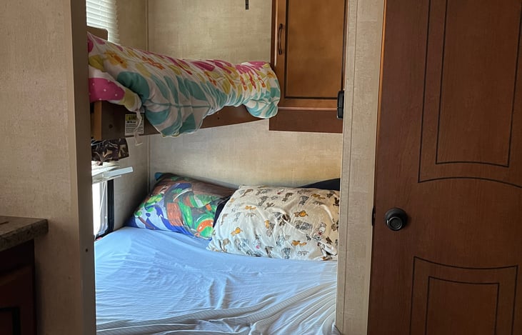Main bed with folding bunk above