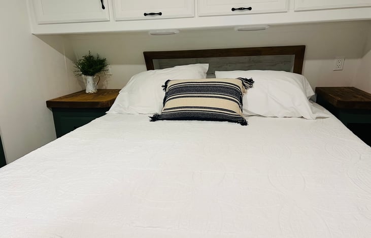 Queen sized mattress in master bedroom