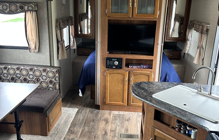 Entertainment center with DVD player, radio, mp3, line in cord, and USB. Indoor and outdoor speakers.