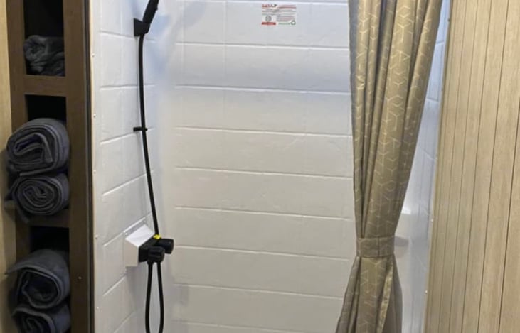 Tankless water Heater!!! Hot water will not run out as long as you have fresh water.