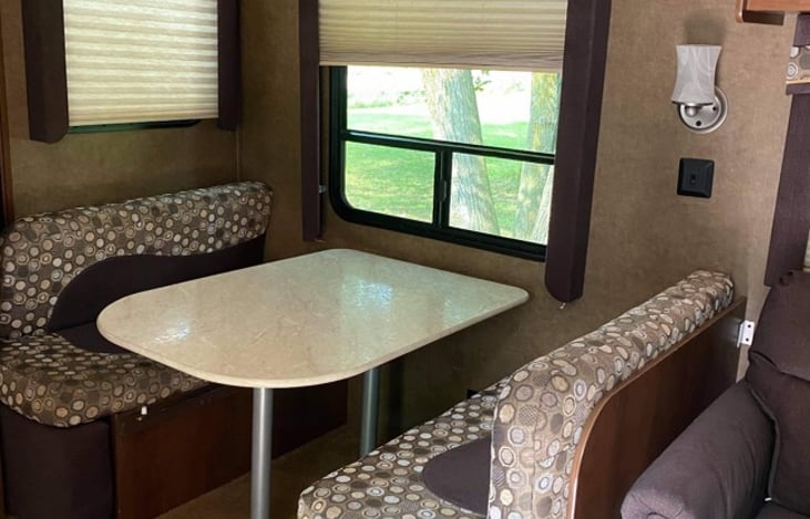 Dinette in kitchen/living room. 

Dinette folds down into a double bed