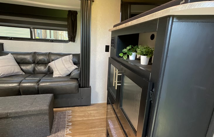 Media cabinet/fireplace. Fireplace can be used for ambiance lighting in the summer or warmth in the early spring or fall.