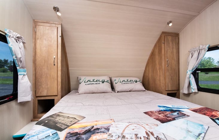 USB charging ports and 110v outlets are available on both sides of the Queen size bed.