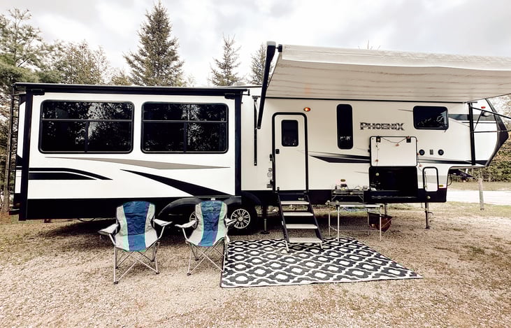 The perfect campsite setup!  Rental includes a camp kitchen, two chairs, and an outdoor rug.