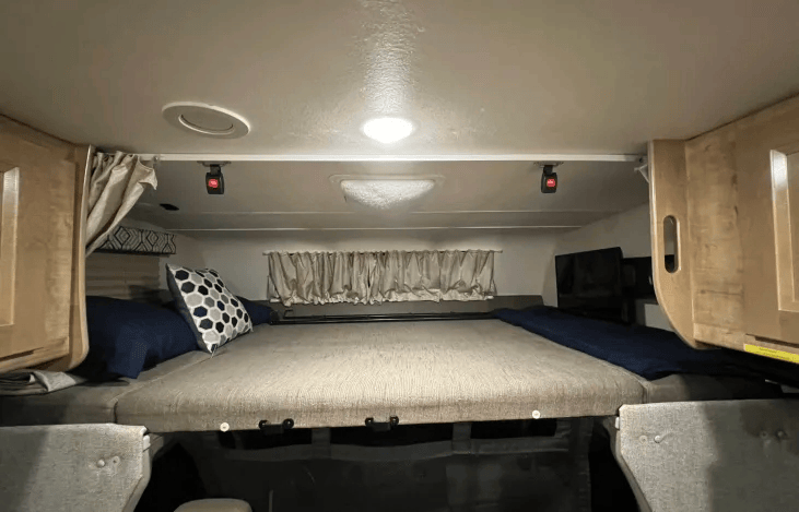 Overhead bunk bed above the drivers can sleep up to 2 with a weight max of 350lbs