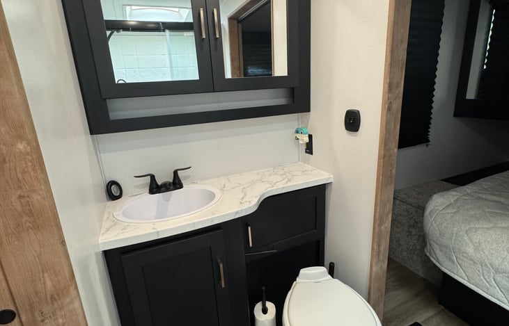 Porcelain toilet & full bathroom vanity