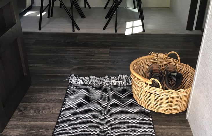 At the main entrance to the camper, you can step right into our spacious living and dining room area ready for you to relax and enjoy. We equip our kitchen with dishes for 8.