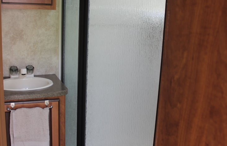 Bathroom is stocked with hotel amenity sized goodies as well as RV approved toilet paper.