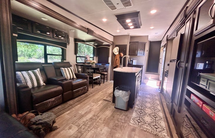"Chef’s Kitchen: Features a large island, residential fridge, and plenty of prep space."