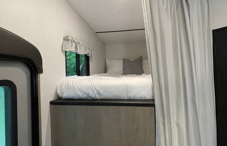 Bunks are equipped with privacy curtain that can close the sleeping area off completely.