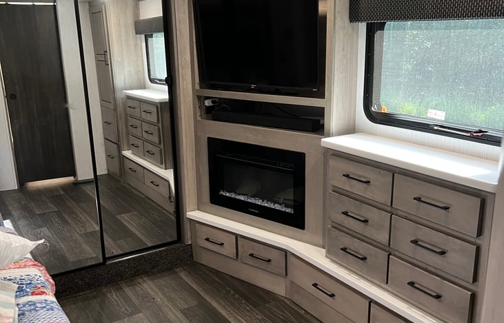 Large bedroom with super slide king sized bed, electric fireplace, tv, and WiFi