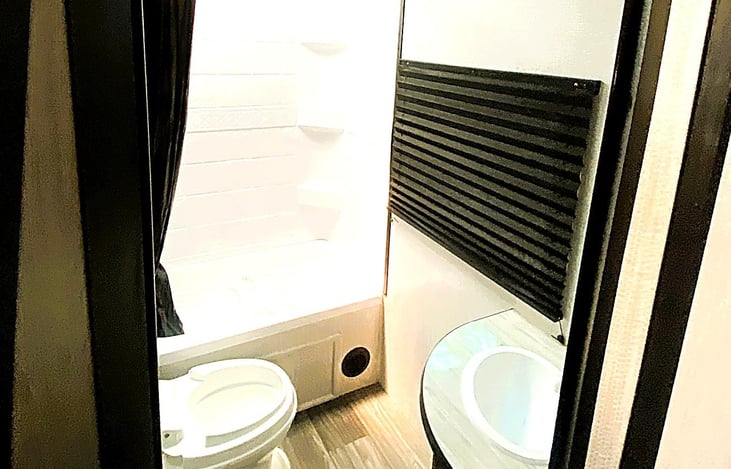 Spacious and well-lit bathroom — a rare find among affordable travel trailers. Great for camping near Zion National Park, Lake Perris, Newport Dunes or Ocotillo Wells.