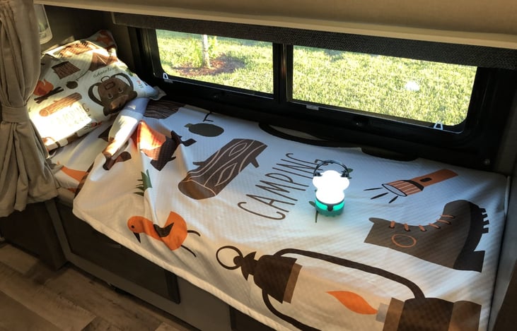 Your kids will LOVE the bunk beds. Each has it's own window, night light, lamp, cargo net pouch, and TV/DVD.