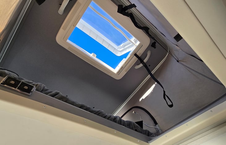 Bunk access with adjustable position sunroof.