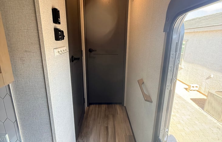 Front "hallway" with hooks for hanging jackets or towels.