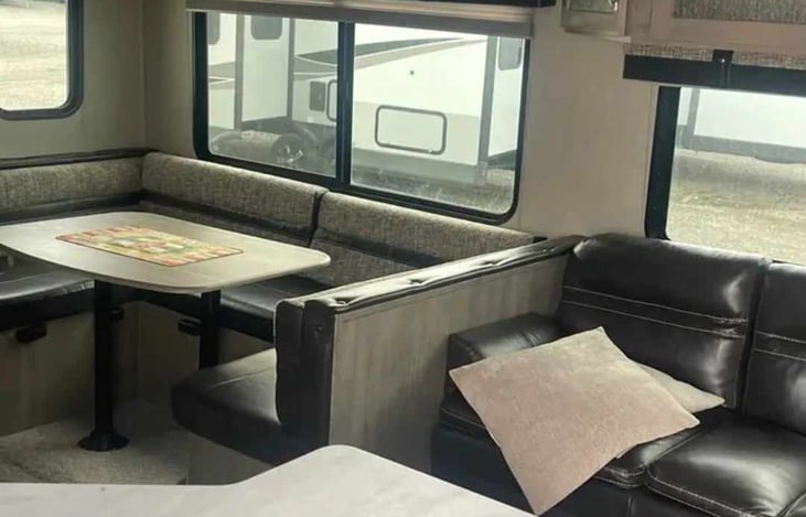 U-shaped kitchen dinette that converts into a bed