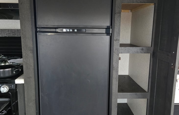 Pantry and large fridge/freezer for ALL your groceries.