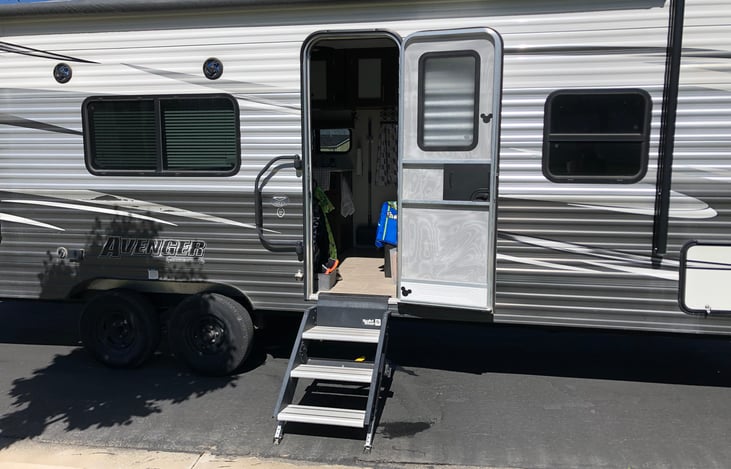 Our trailer is equipped with the tough stairs sure to be steady as you climb. The safety rail, is not a swing- contrary to what our children think! But it will keep you balanced as you go in and out.