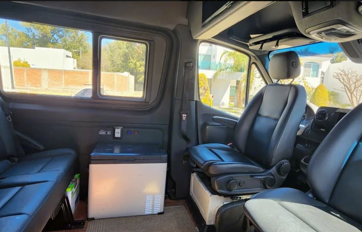 The spacious interior seating area for 5 is unique for an adventure Van.  All seats are DOT tested Mercedes factory seating.