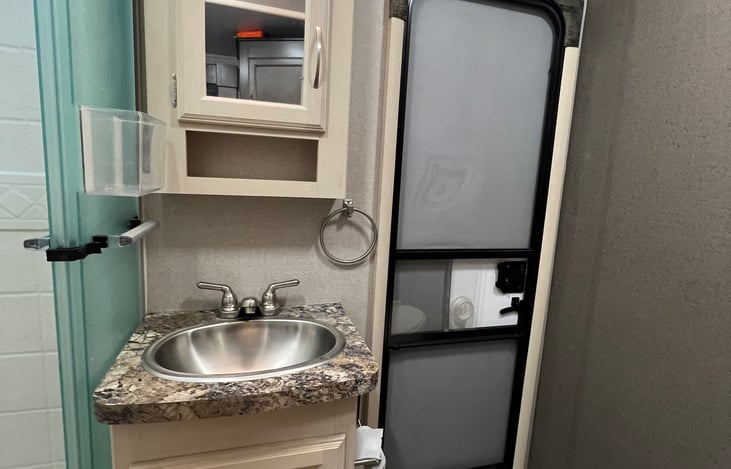 Sink with door access to outside.