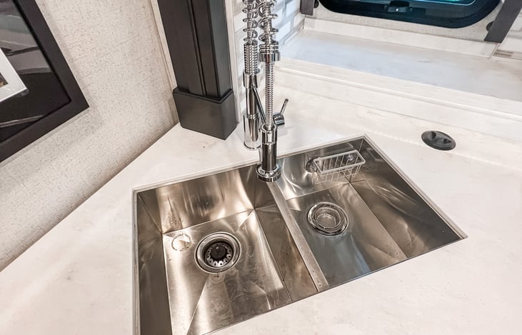 Deep stainless steel sink perfect for meal prep and clean-up