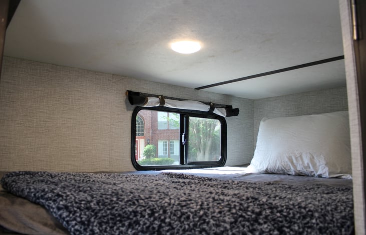 Top bunk- comes with its own view, over head light & small shelf with 2 usb charging ports!