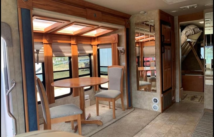 Kitchen slide with Atrium for star viewing. Space for queen air bed.