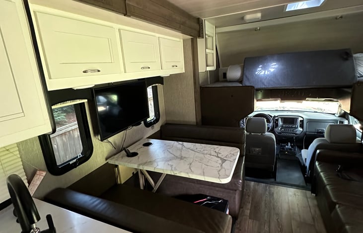 Dinette. *Coverts into a sleep sofa if needed.  Forward facing bench has two seat belts.