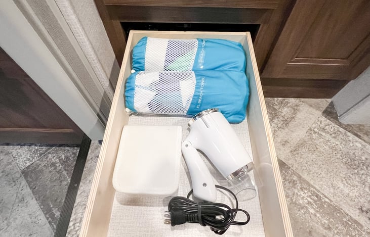 Two XL beach towels, sewing kit, and hair dryer included