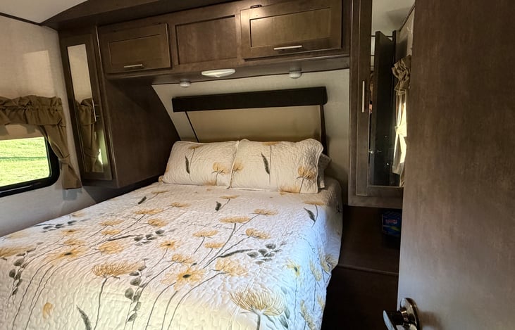 Queen bed with plenty of storage, cabinets for hanging clothes, and tv. This room has it's own thermostat so you can sleep comfortably.