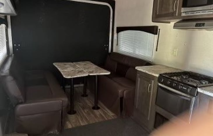 Kitchen area and table/ 2 Couch Beds