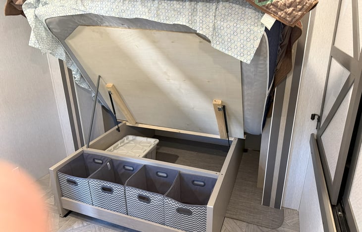 Under bed storage.  The bed is heavy with the real mattress.