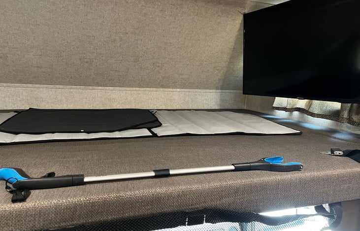 Over the cab queen size bed and ROKU TV