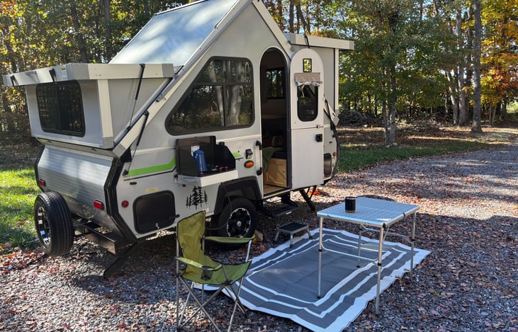 Rental includes outdoor chairs, Coleman camp table and 5x8 rug.
