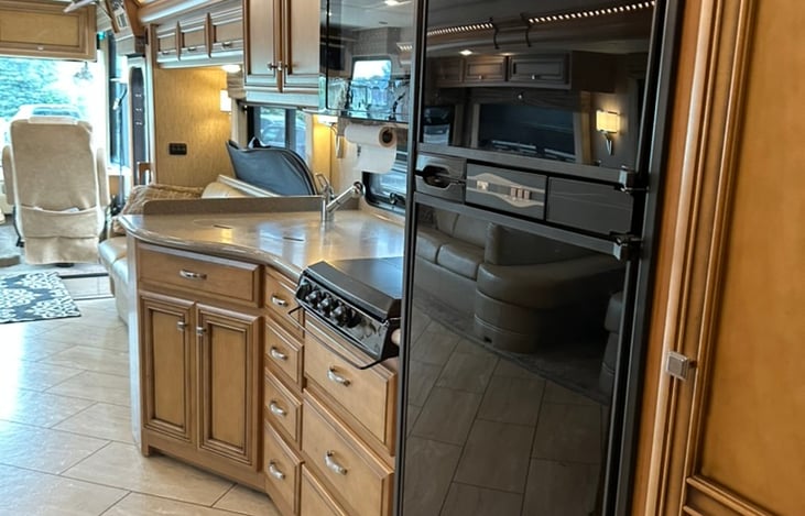 Refrigerator with ice maker and 3 burner stove